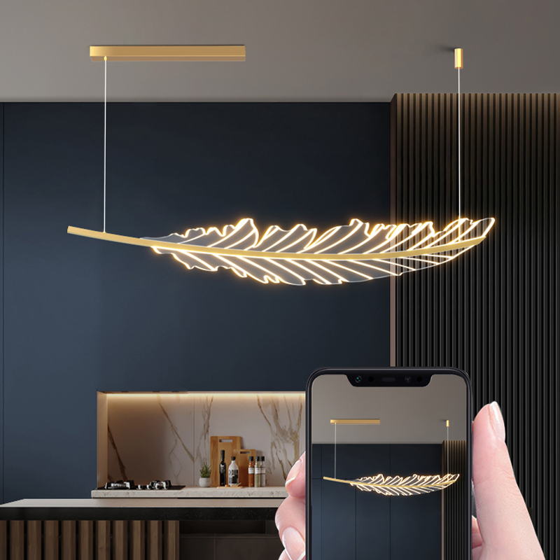 Elegant gold leaf pendant light hanging above a kitchen island, showcasing its unique design.