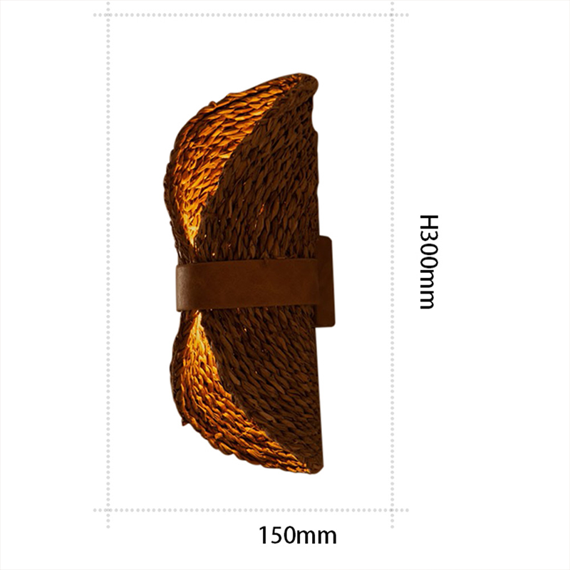 Side view of the Boho Chic Handwoven Rattan Wall Lamp showcasing its intricate design and warm glow.