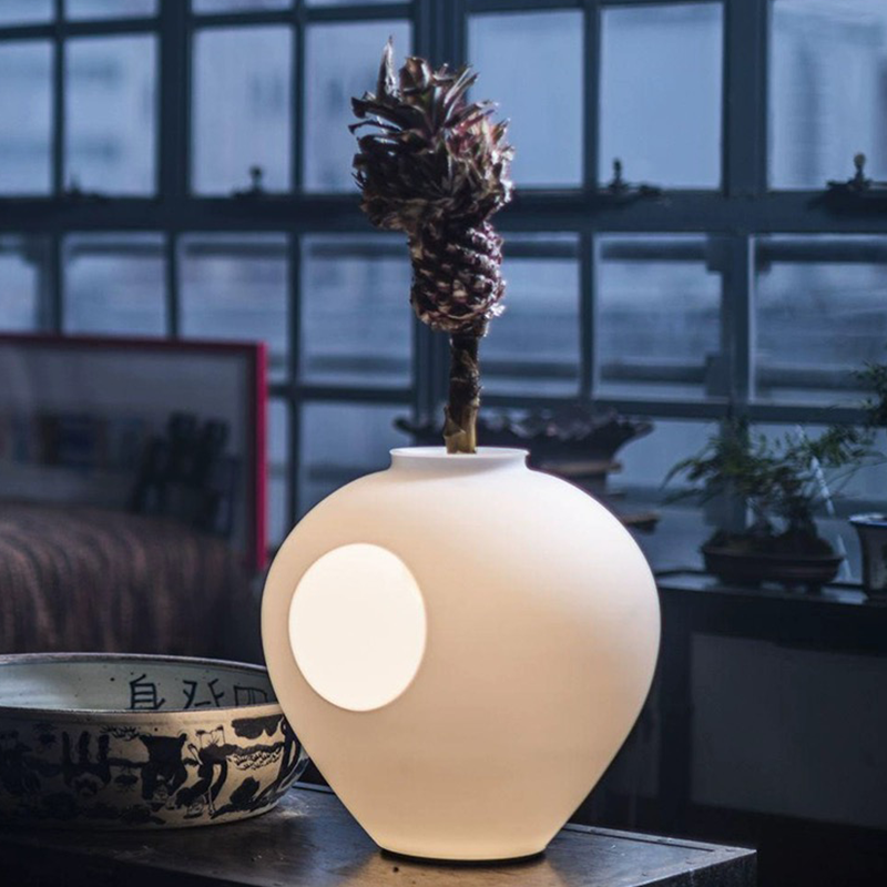 Side view of LumaBloom wireless vase lamp showing floral arrangement and LED glow