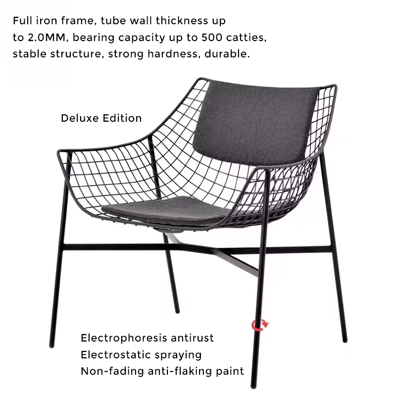 Modern outdoor armchair featuring a removable washable cushion in a vibrant garden setting.