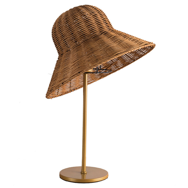 Rattan weaving table lamp on a bedside table, perfect for new homeowners.