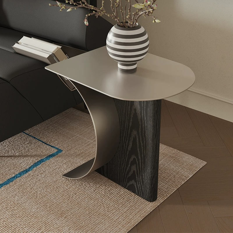 View of the Chic Crescent Moon Coffee Table with a cozy setup, featuring stylish decor items on the surface.