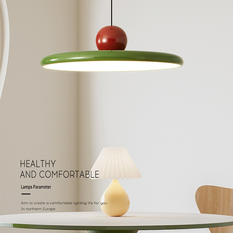 Modern kitchen with the flying saucer pendant light illuminating the island.