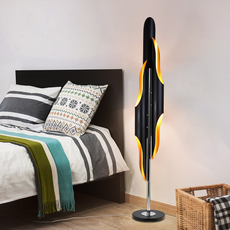 Elegant lamp placed beside a bed, demonstrating its use as a cheap bedside lamp for the living room.