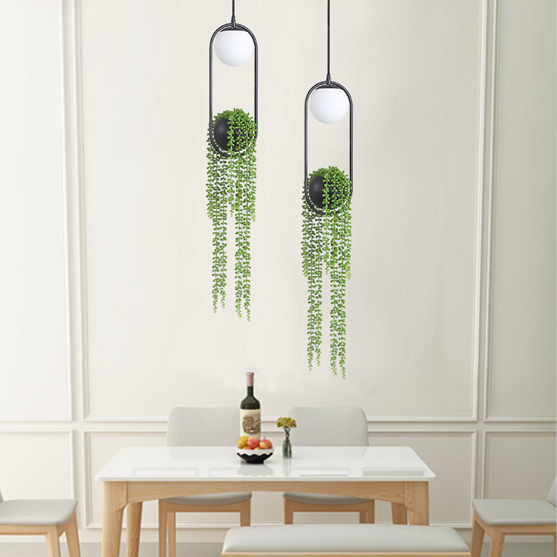 Chic modern LED plant pendant light showcasing indoor plants in a stylish setting.