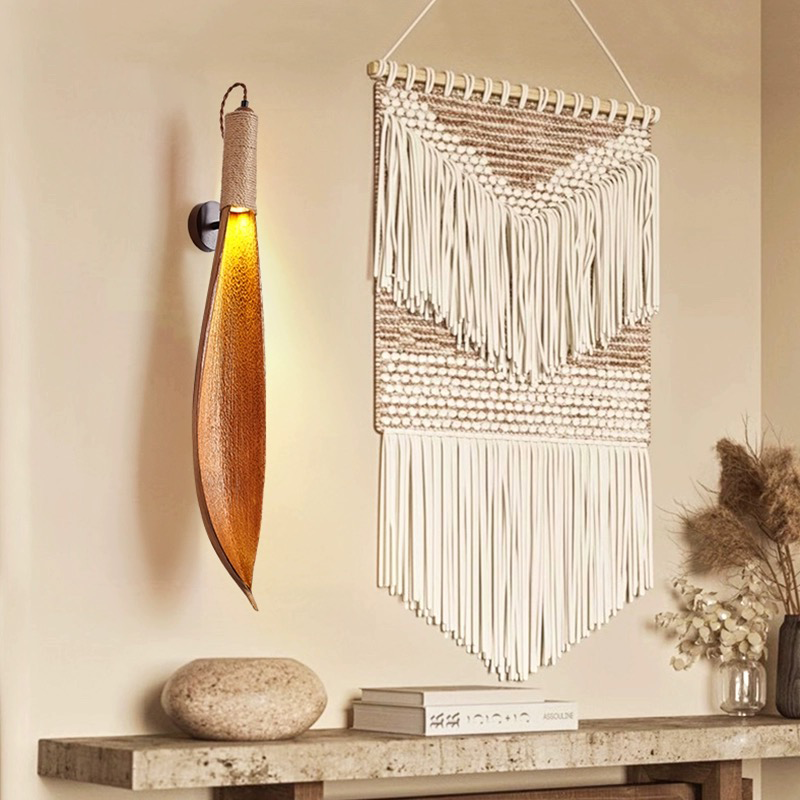 Rustic LED wall sconce with cocoa leaf design, perfect for modern decor lighting.