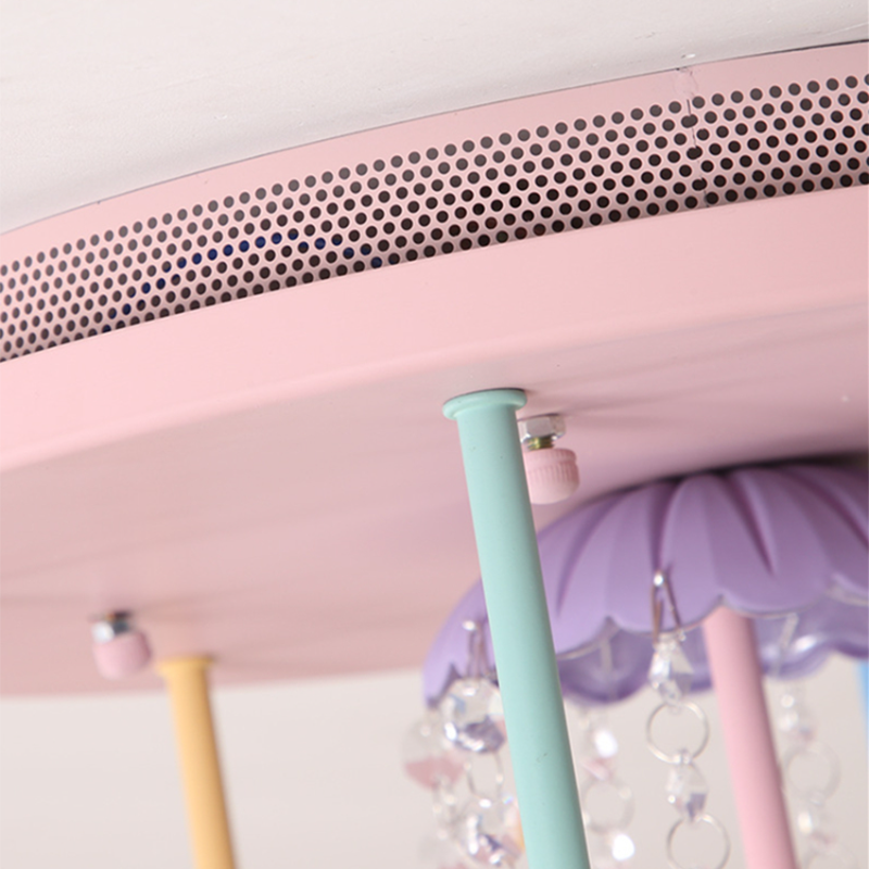 Installation process of the Macaron chandelier in a childrens bedroom.
