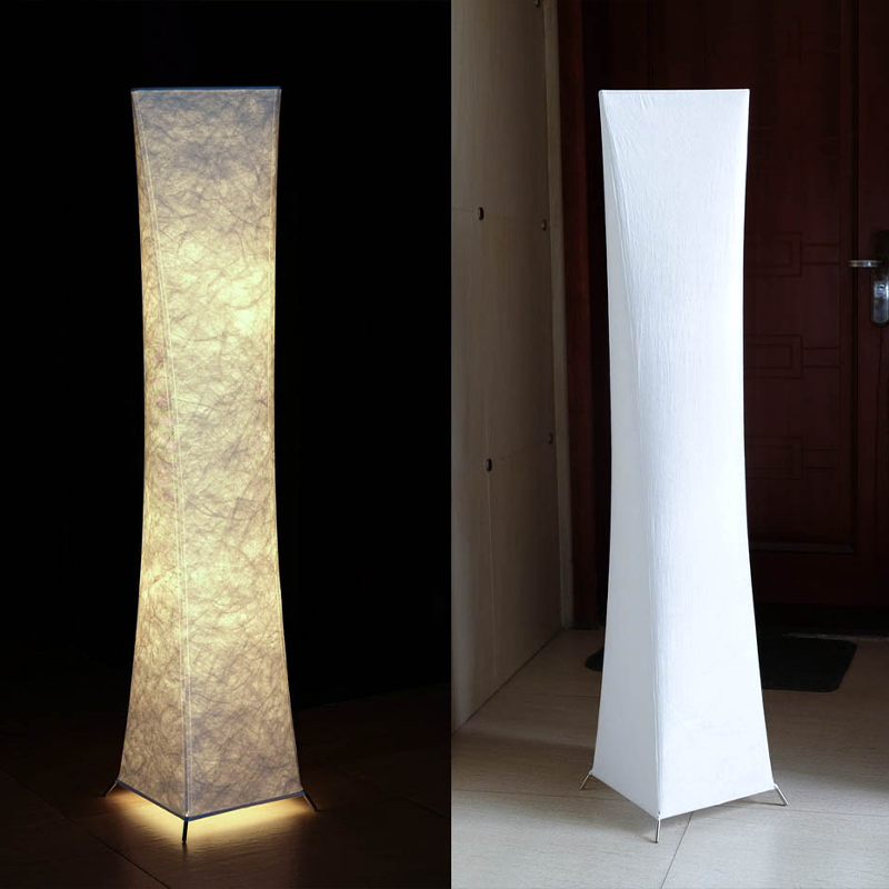 Nordic LED floor lamp placed beside a bed, enhancing the bedrooms ambiance.