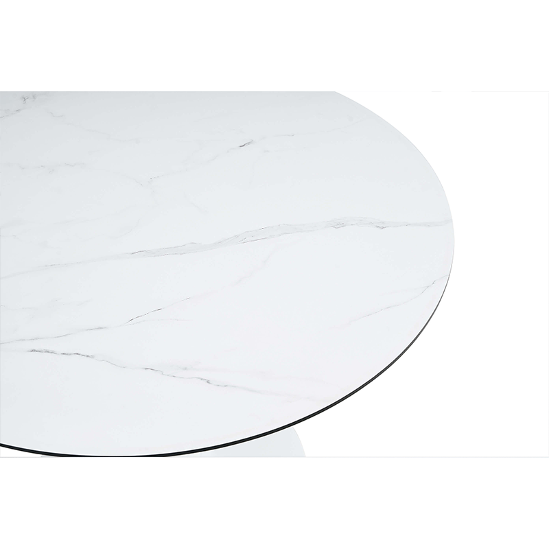 Elegant white round marble tulip base dining table set in a modern dining room.