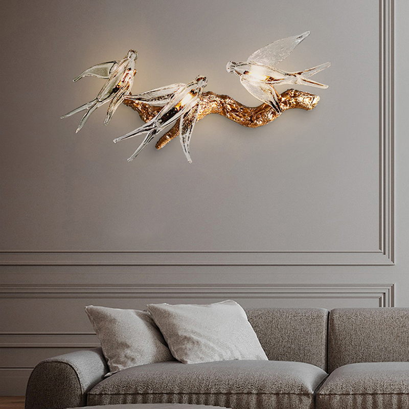 Copper Swallow LED Wall Sconce showcasing a luxurious glow in a living room setting.