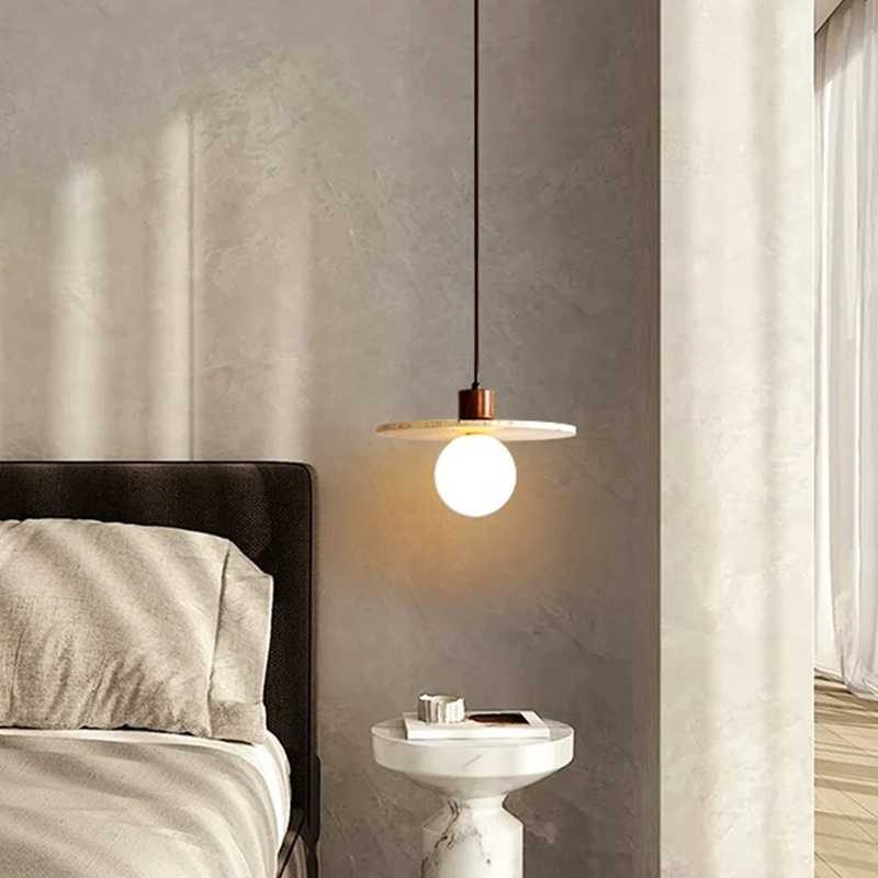 Close-up of the polished surface of the warm light fixture, highlighting its modern design.