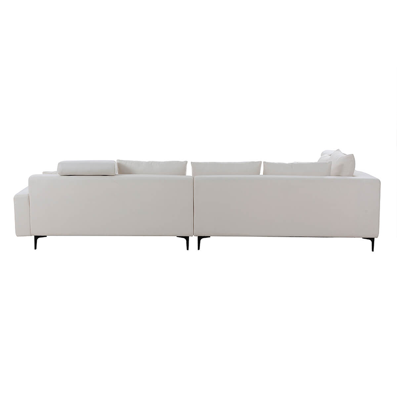 Luxurious off white reversible sectional sofa with ottoman in a contemporary living room.