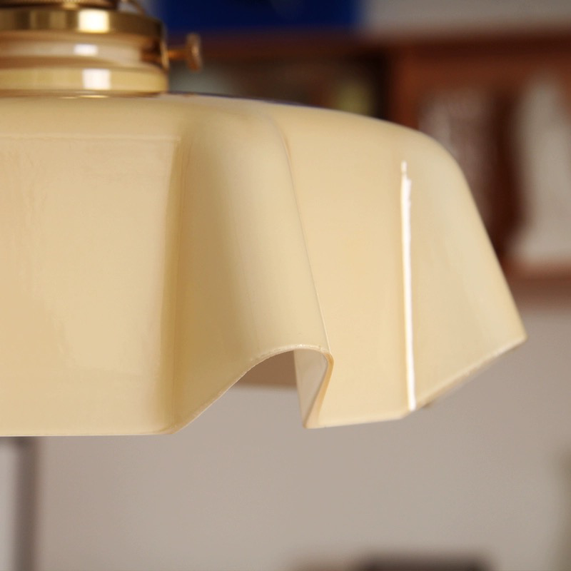 Vintage Elegance Wavy Glass Pendant Light illuminating a cozy living room, creating a warm ambiance.
