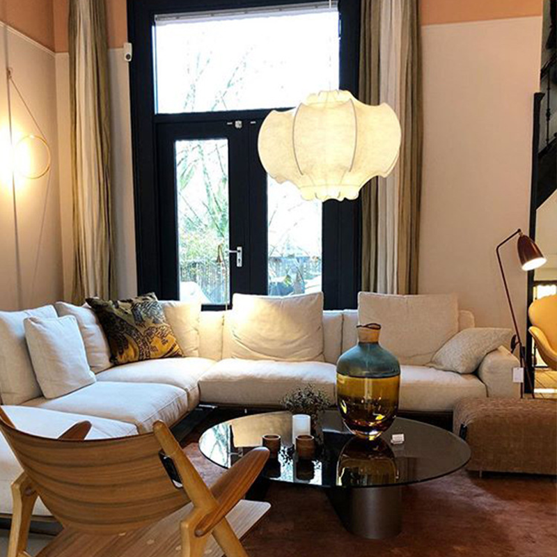 A dining room featuring the Nordic LED pendant light, creating a warm and inviting atmosphere.