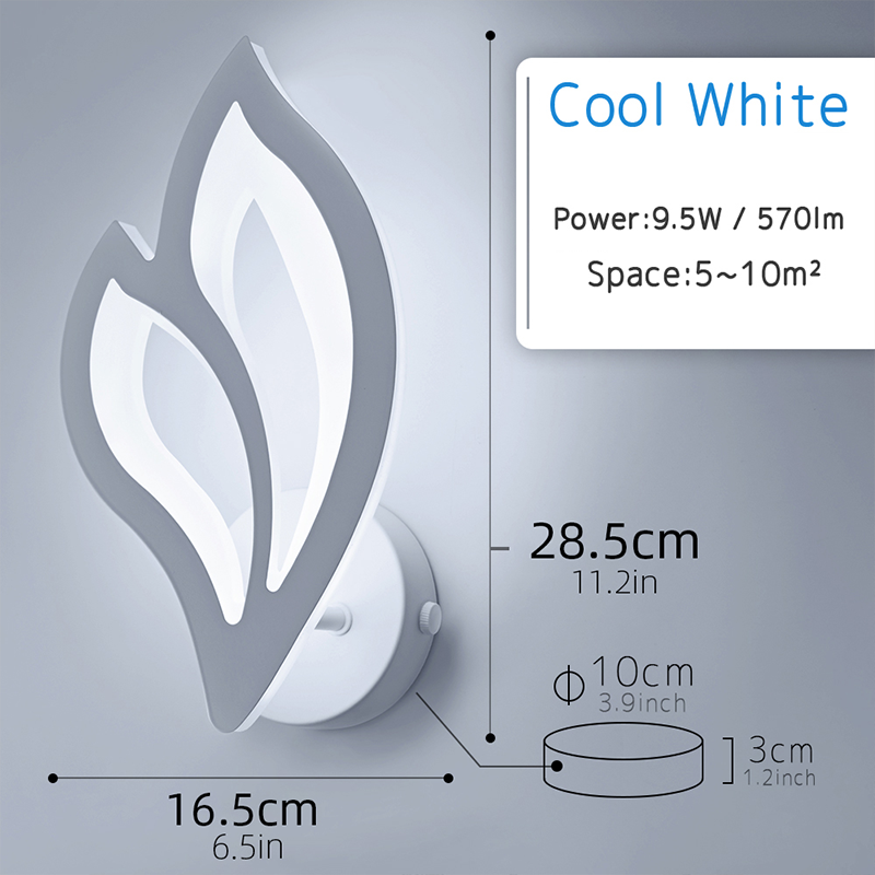 Elegant white leaf LED wall sconce showcased in a cozy cafe setting.