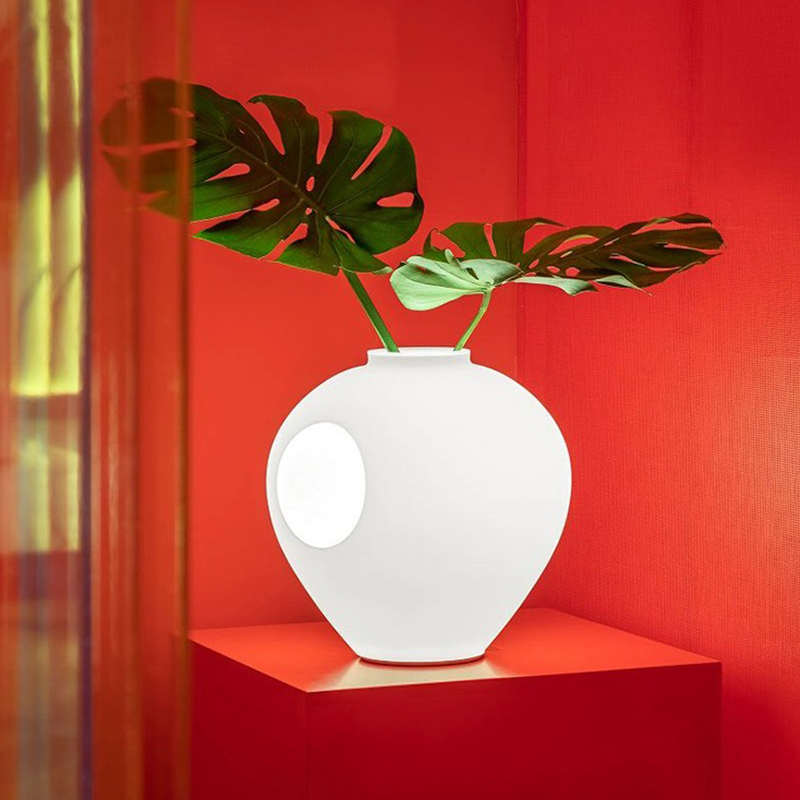 Side view of LumaBloom wireless vase lamp showing floral arrangement and LED glow