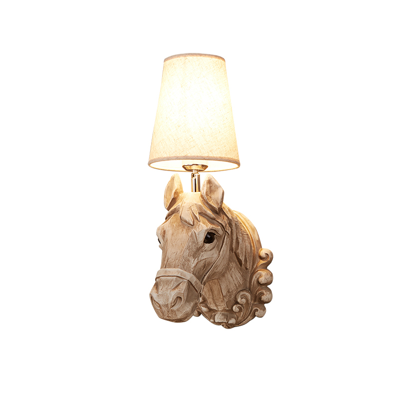 Rustic Horse Resin Wall Lamp installed in a cozy living room, illuminating the space with warm light.