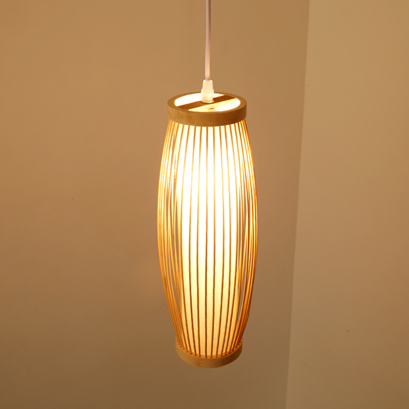 Elegant handwoven bamboo lantern pendant light in a cozy living room setting.