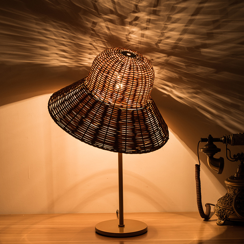 Side view of the bamboo table lamp illuminating a cozy living room.