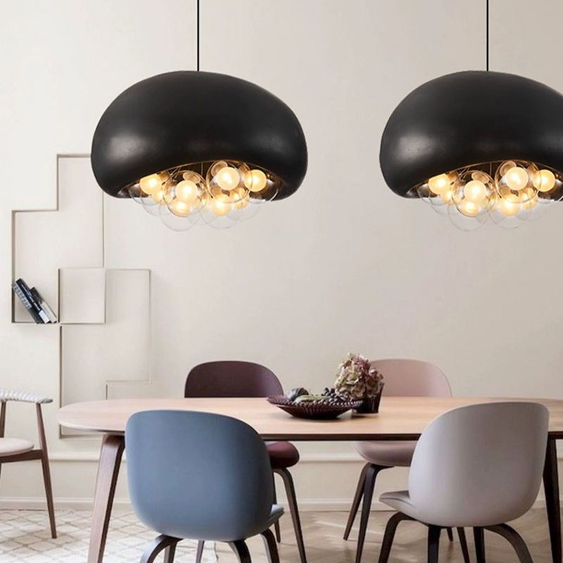 Artistic Bubbles Resin Pendant Light illuminating a dining room with modern decor.