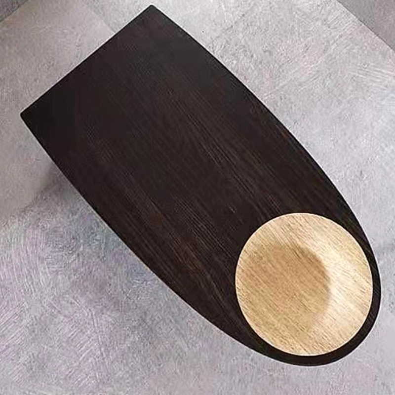 Front-facing view of solid wood desk in black, showing minimalist frame and natural wood texture