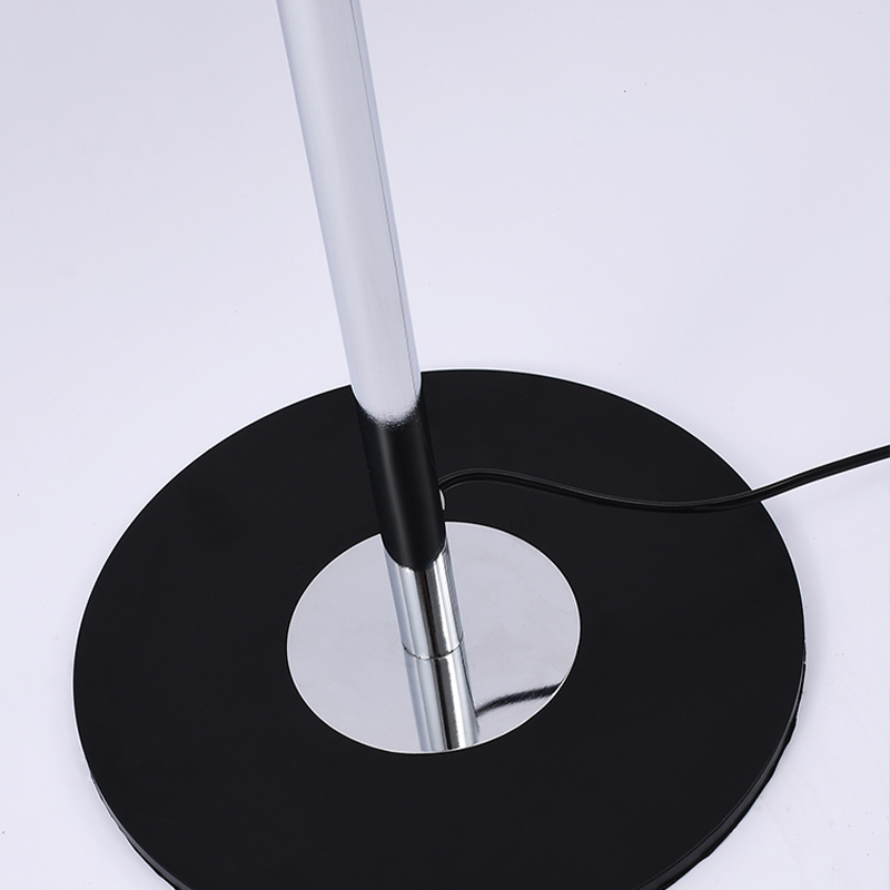 Elegant Golden Black Aluminum Tube Floor Lamp in a cozy living room setting.