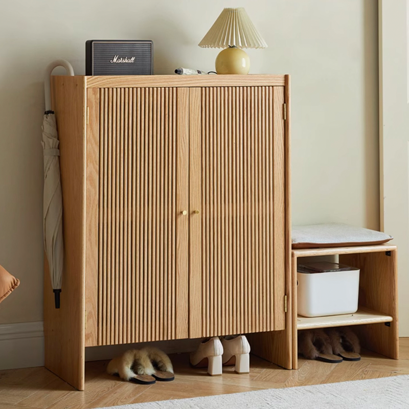 Close-up of adjustable dividers within the cabinet, illustrating how it accommodates different shoe types.