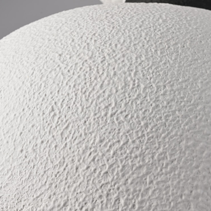 Close-up view of the LED chandelier illuminating a cozy bedroom setting, highlighting its warm glow.