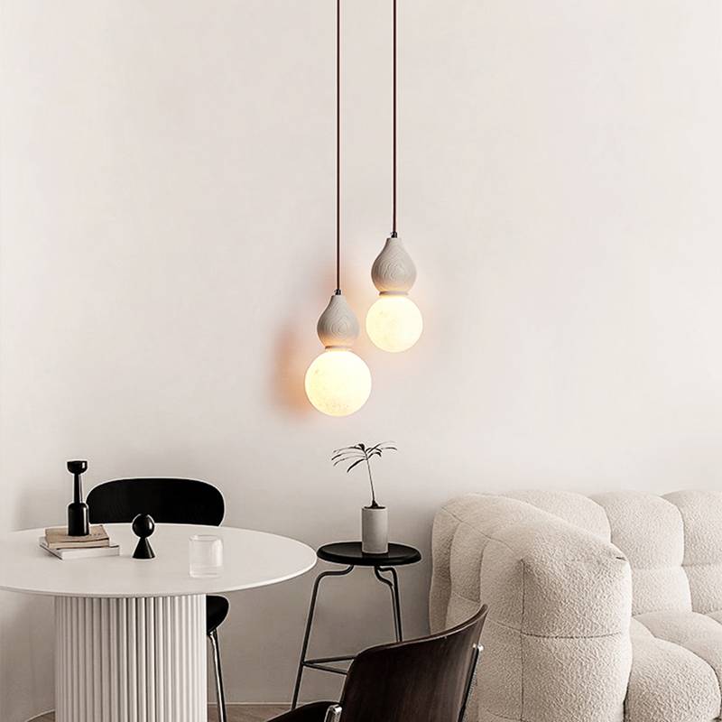 Artistic Antique Pendant Light from a side angle, highlighting the unique sphere design.