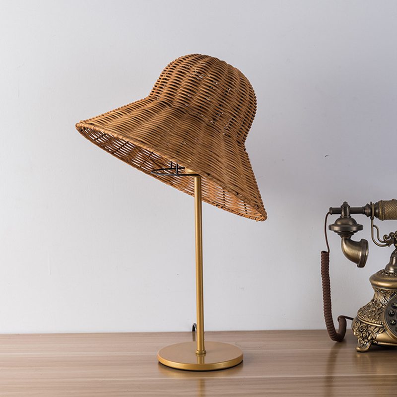 Rattan weaving table lamp on a bedside table, perfect for new homeowners.