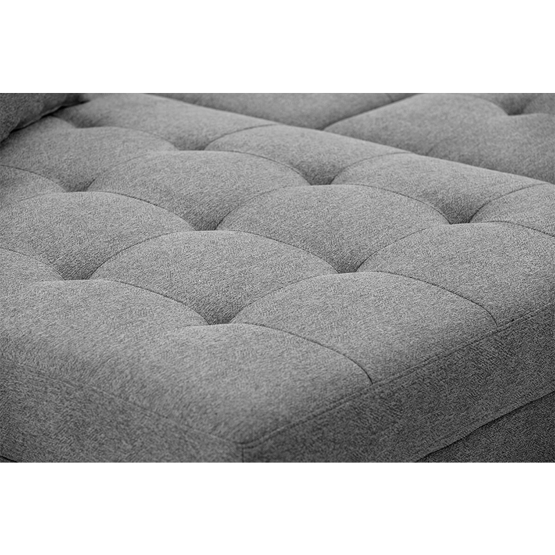 Affordable tufted couch for living room showcased in a cozy corner.