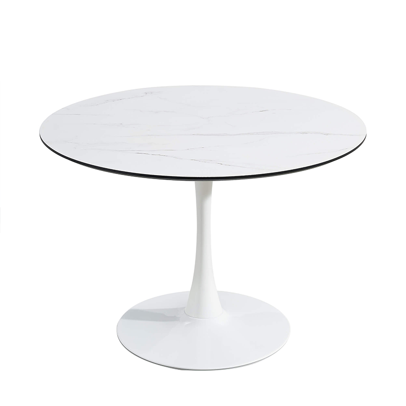 Elegant white round marble tulip base dining table set in a modern dining room.