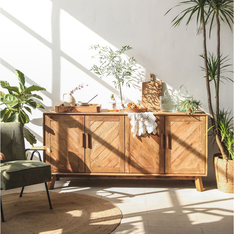 Interior view of the sideboard cabinet displaying ample storage space and woven cane front design.