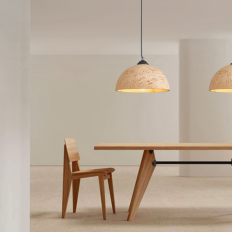 Modern pendant lamp illuminating a cozy dining area in a restaurant.