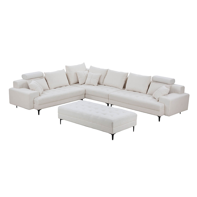 Luxurious off white reversible sectional sofa with ottoman in a contemporary living room.