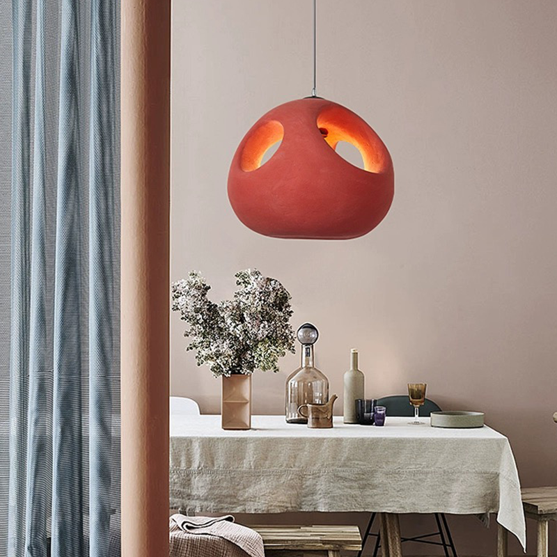 Close-up of the Nordic pendant light illuminating a cozy living room setting.