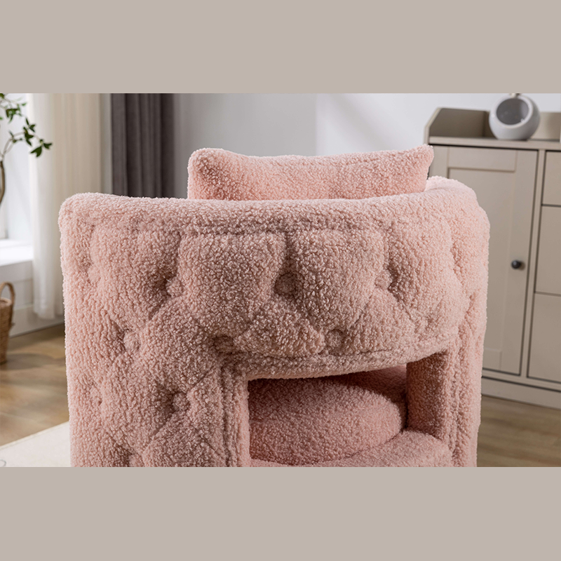 Front view of the pink upholstered swivel vanity stool showing tufted back and gold base.