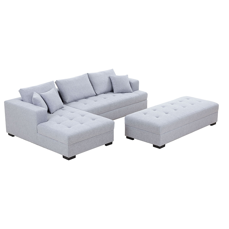 Stylish light grey sectional with ottoman, perfect for lounging