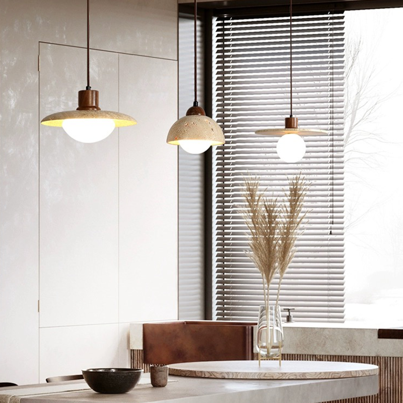 Luxe warm light pendant showcasing the yellow cavity-stone from a side angle, ideal for dining rooms.