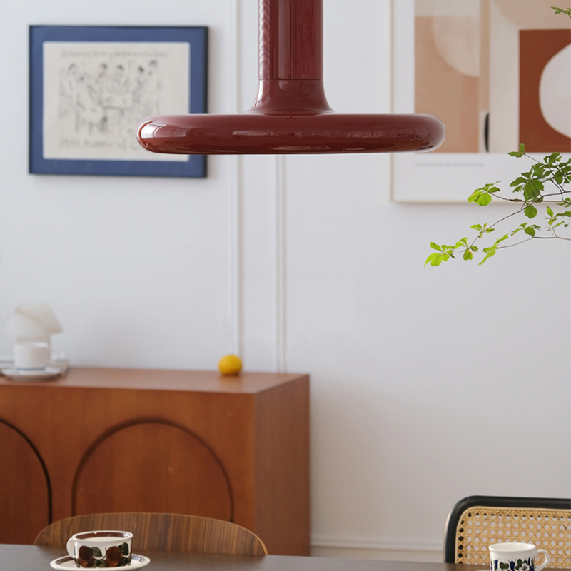 Retro Red UFO Pendant Light showcasing its wide shade in a cozy dining area.