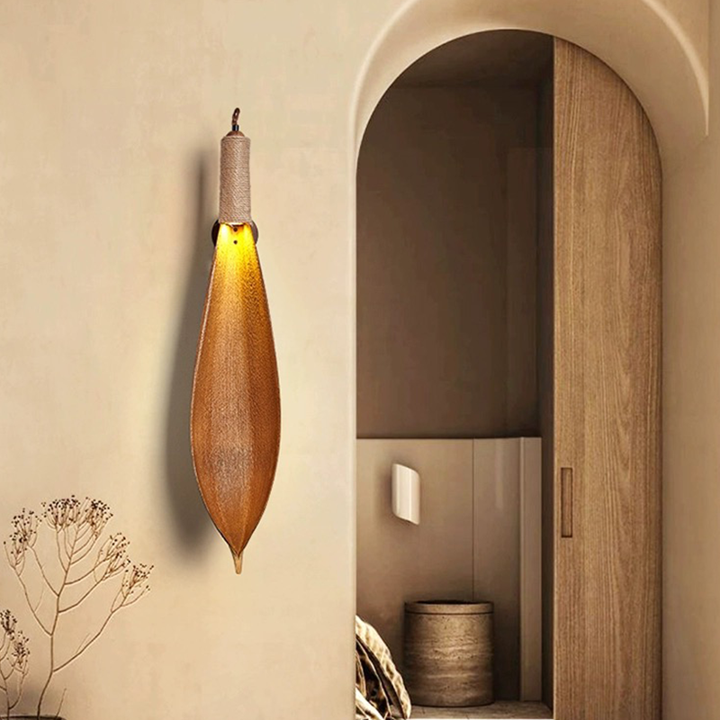 Rustic LED wall sconce with cocoa leaf design, perfect for modern decor lighting.