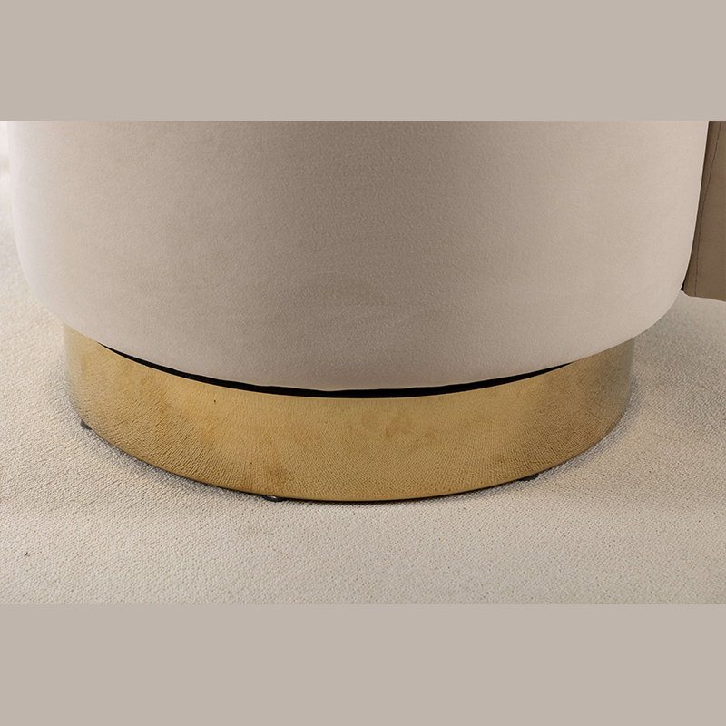 Elegant beige swivel barrel chair in a cozy living room setting.