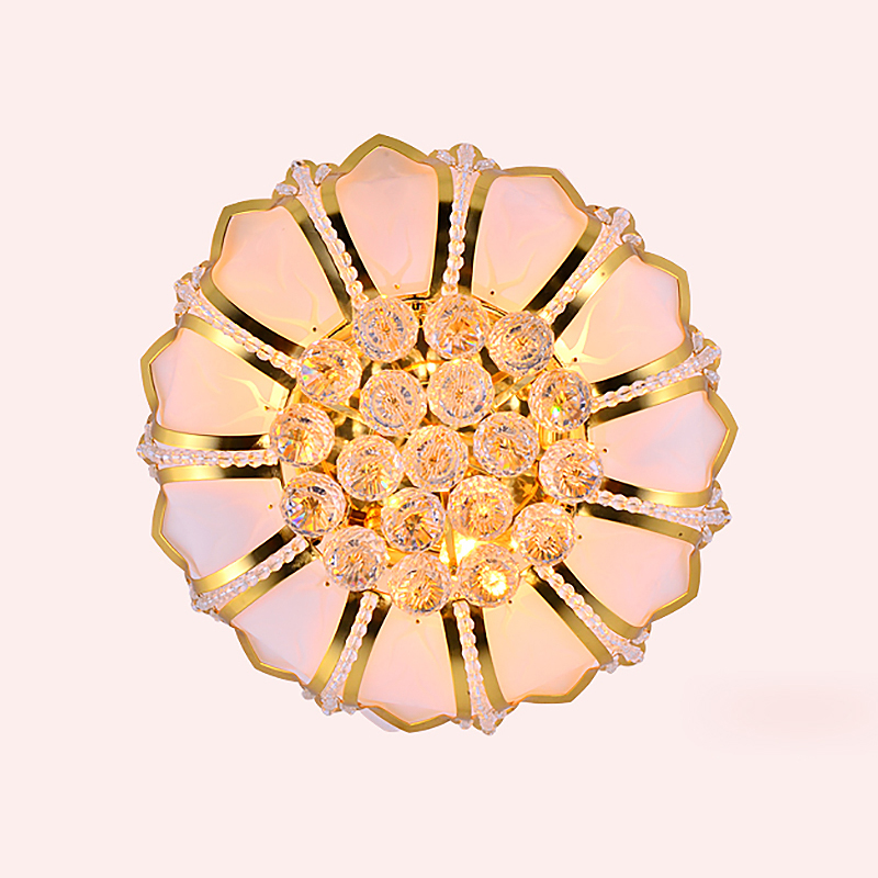 Elegant gold lotus flower ceiling light showcasing its crystal shade in a stylish living room.