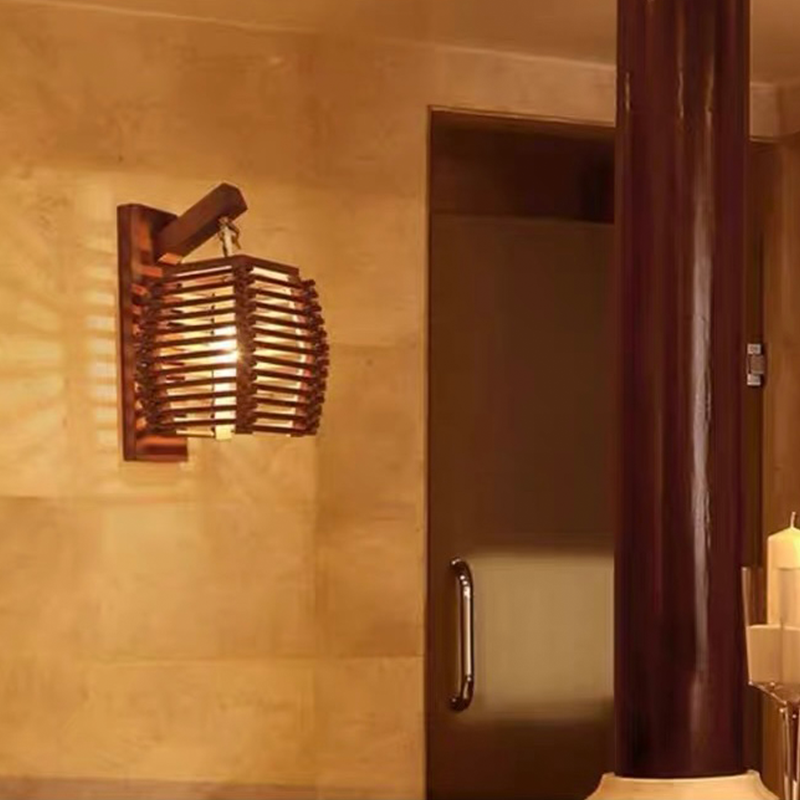 Elegant bamboo lantern wall lamp showcasing natural wood finish in a cozy living room setting.