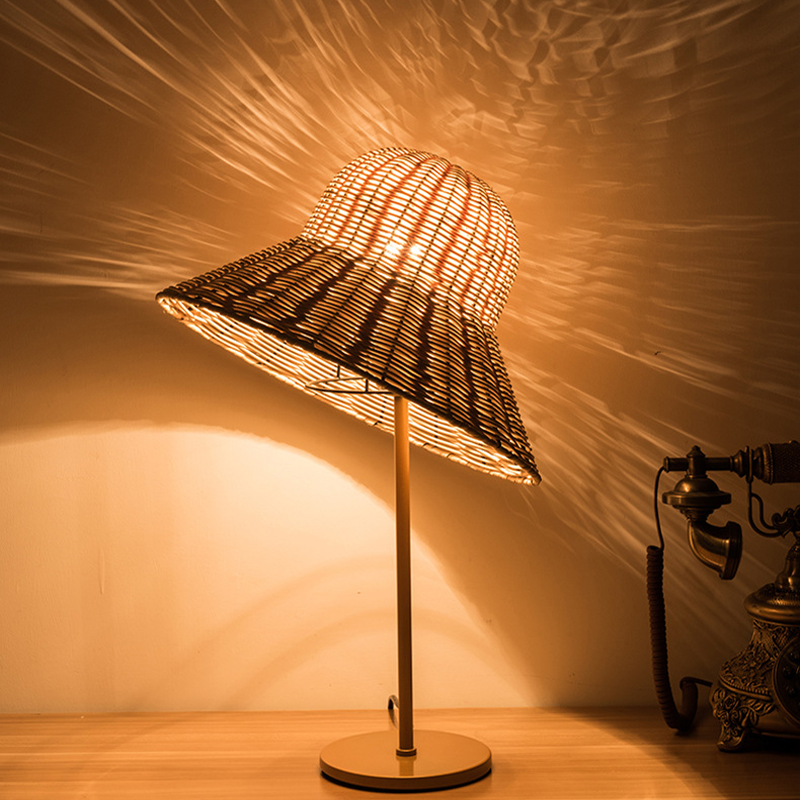 Rattan weaving table lamp on a bedside table, perfect for new homeowners.