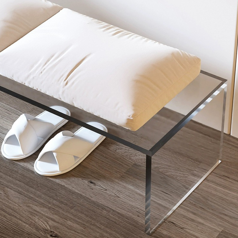 A blue acrylic bench showcasing a sleek design, perfect for resting.