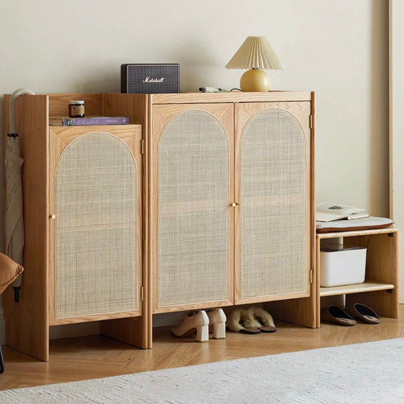 Side view showing the cabinets key and umbrella hanging features, emphasizing its creative shoe storage solutions.