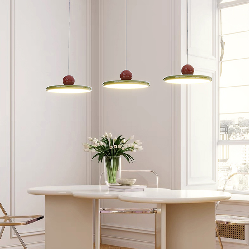 Close-up of Retro Flying Saucer Pendant Light showcasing the green finish.