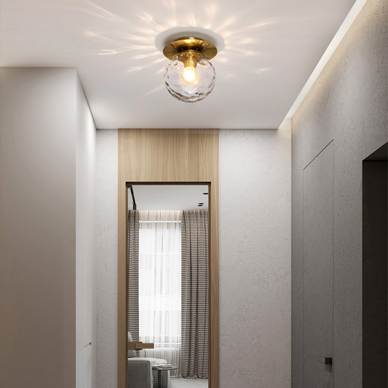 Flush mount light installed in a stylish bedroom, illuminating the space with a warm glow.