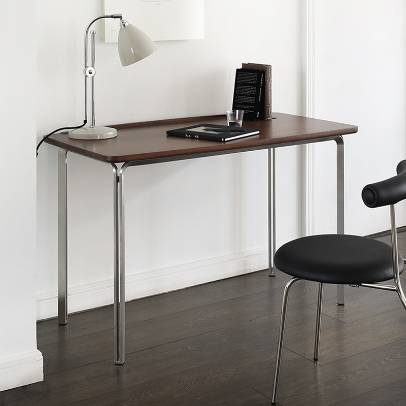 Close-up of the smooth MDF wood finish and steel legs, perfect for home office setups.